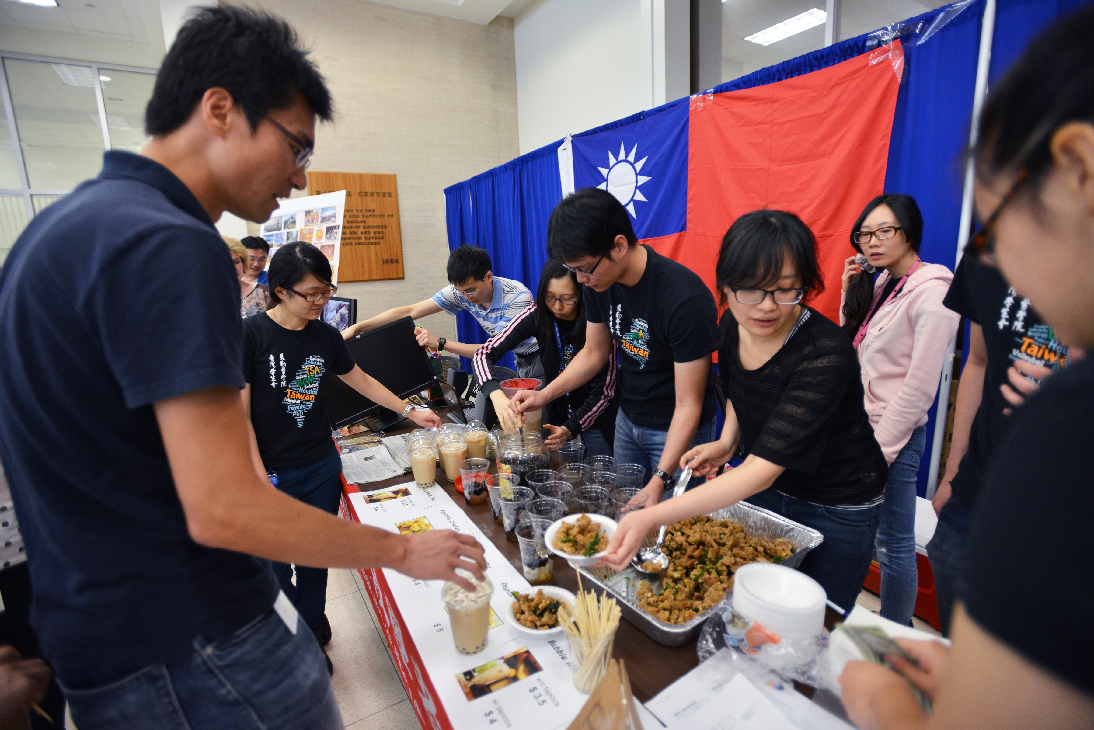 Students and trainees showcasing food from around the world.