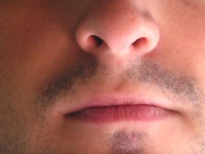 Close up photo of a man's nose and mouth
