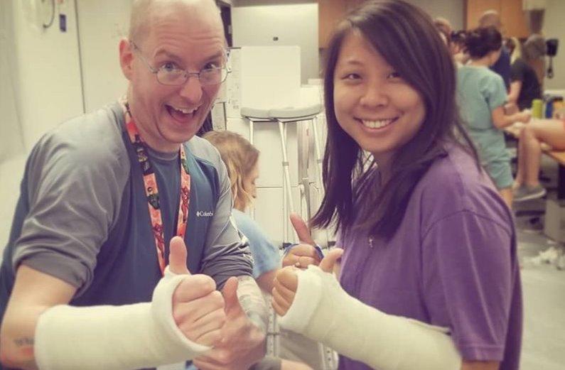 Two Physician Assistant students in casts.