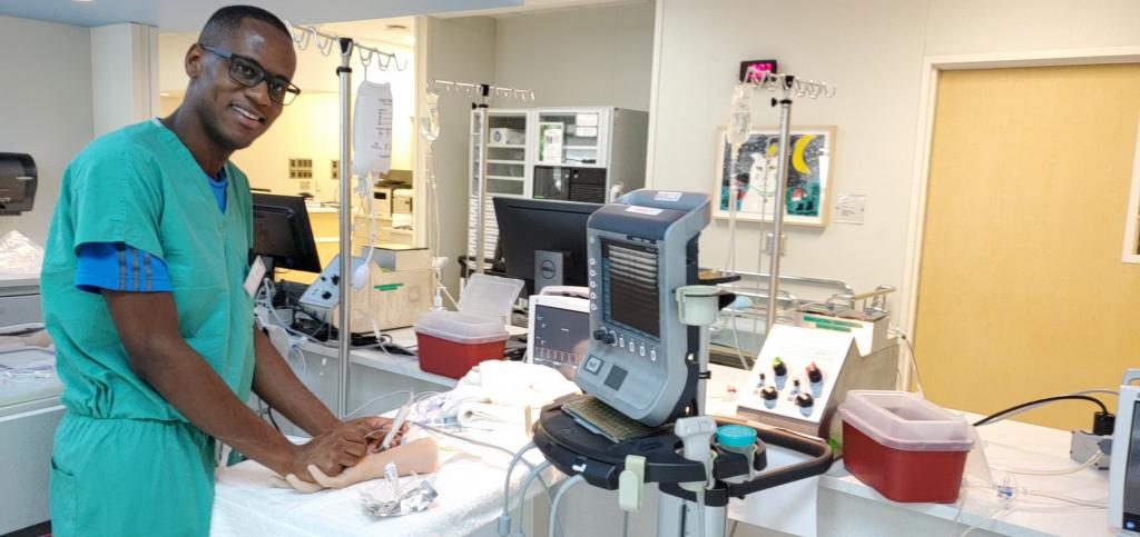 Leshawn Richards practices his ultrasound guided arterial line skills in the simulation lab