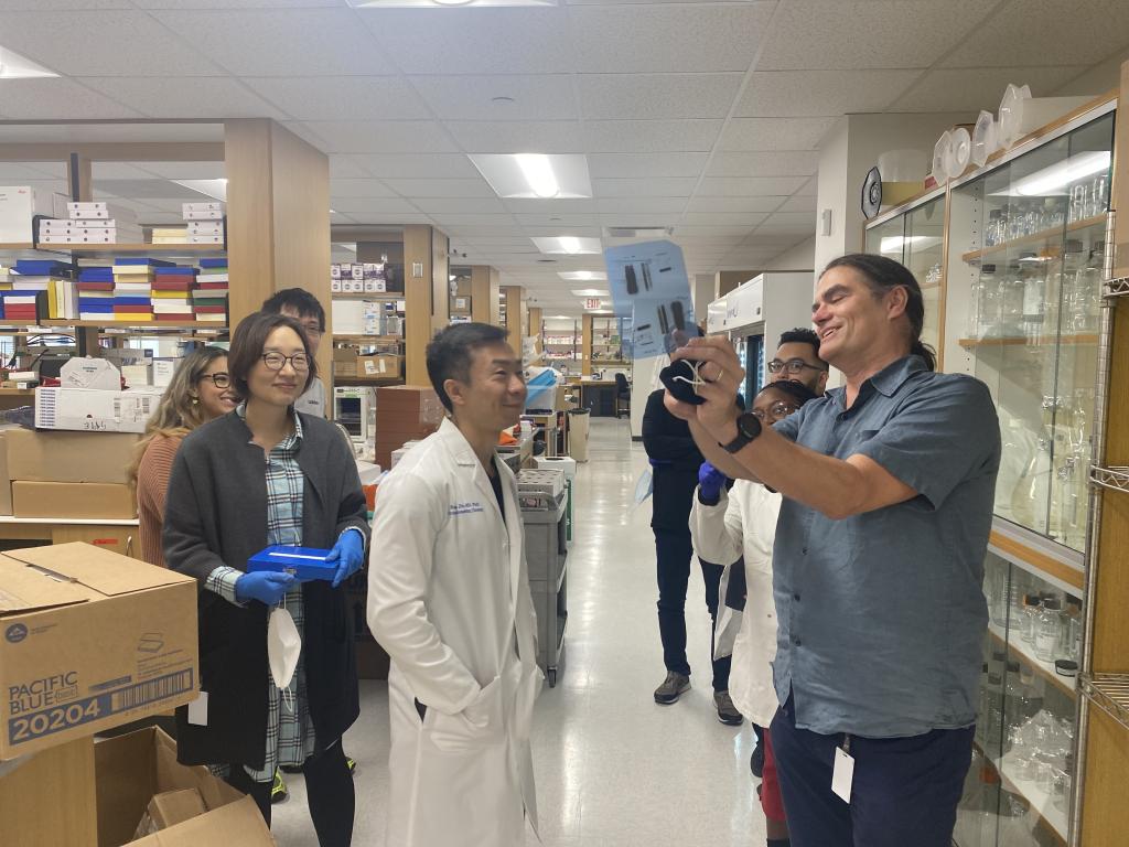 Dr. Mills and lab members working in the recently completed lab facilities.