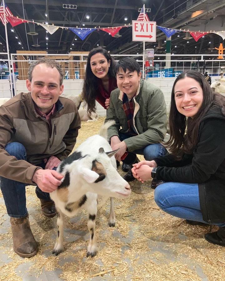 Residents with a goat at a rodeo