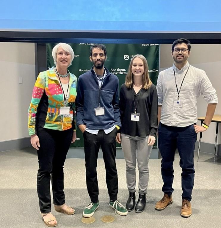 Winners of the 14 presenters: Standing next to Dr. Goodell, first place, Srikanth Kodali, second place, Courtney Chambers, and third place, Gandhar Datar
