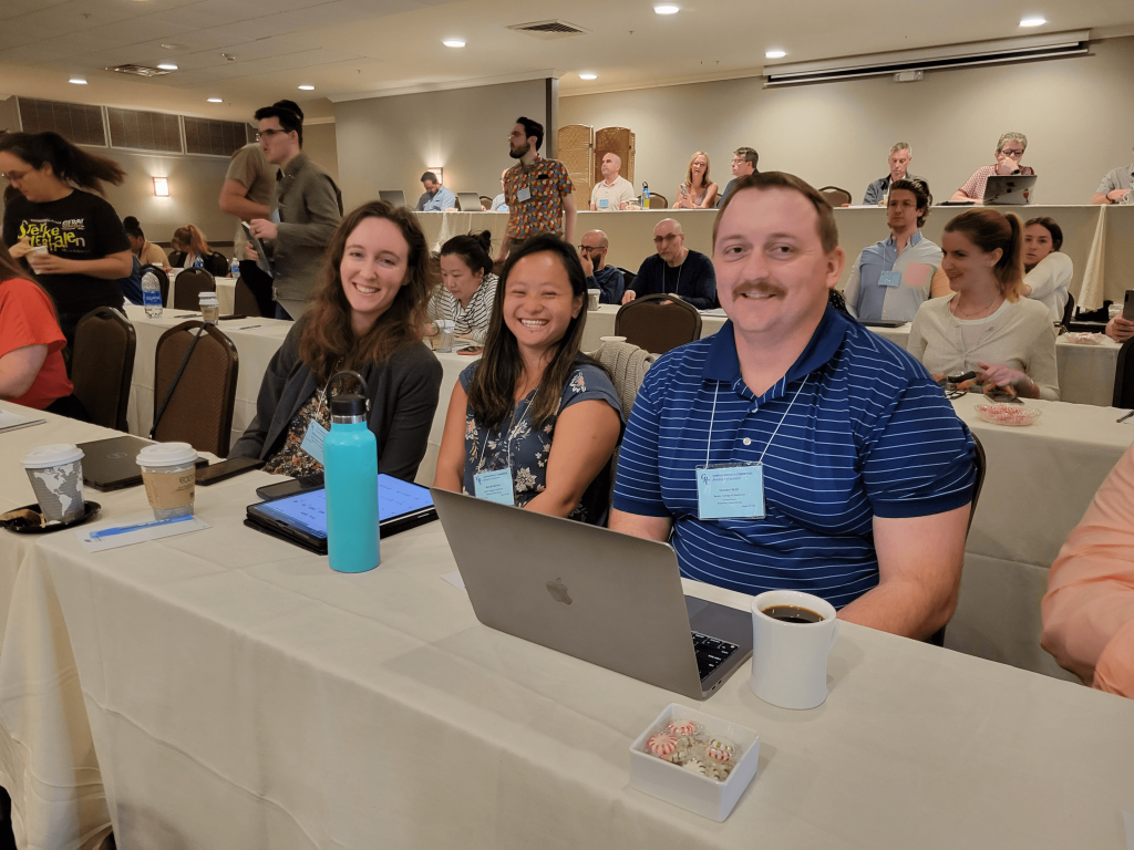 Four lab members attending the 2023 Gordon Research Conference.
