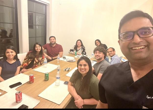 people smiling at a table