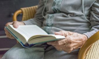 Elderly woman reading a book