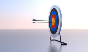 Image of arrows hitting a bullseye on a target to represent reaching your goals. 
