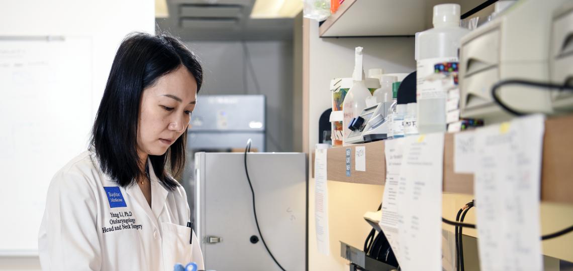 Dr Yang Li working with samples in a lab