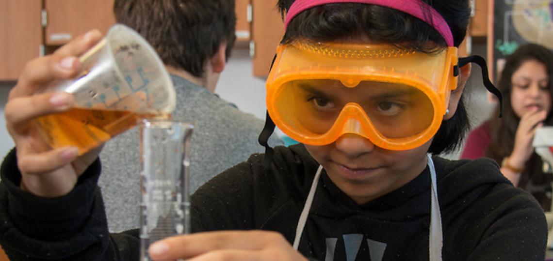 A young student investigates chemical properties as part of an activity focusing on scientific decision-making