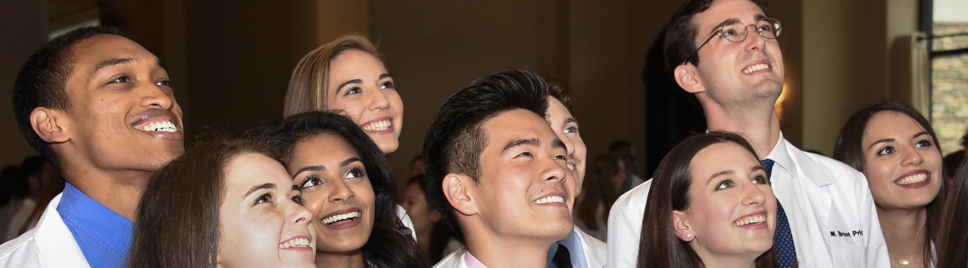 Students celebrating at their White Coat Ceremony