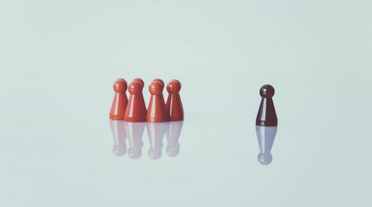 Two different colored sets of chess pieces illustrating racism. Two different colored sets of chess pieces illustrating racism.