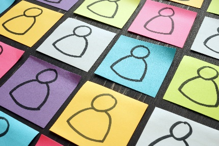 A series of post-it note papers with images of people drawn on them.