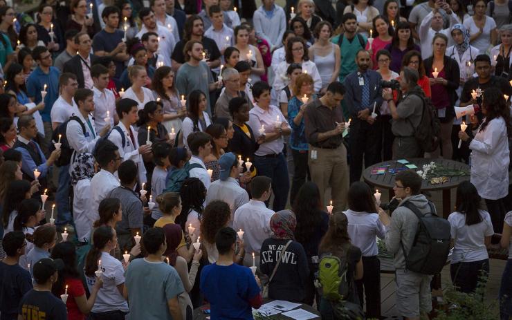 Gathering of students, faculty and staff from across the TMC gathering for candlelight vigil.