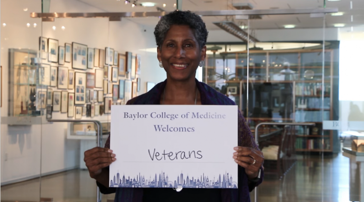 Dr. Alicia D.H. Monroe, senior vice president and provost, holding a "Baylor College of Medicine Welcomes Veterans" sign for Diversity and Inclusion Week video