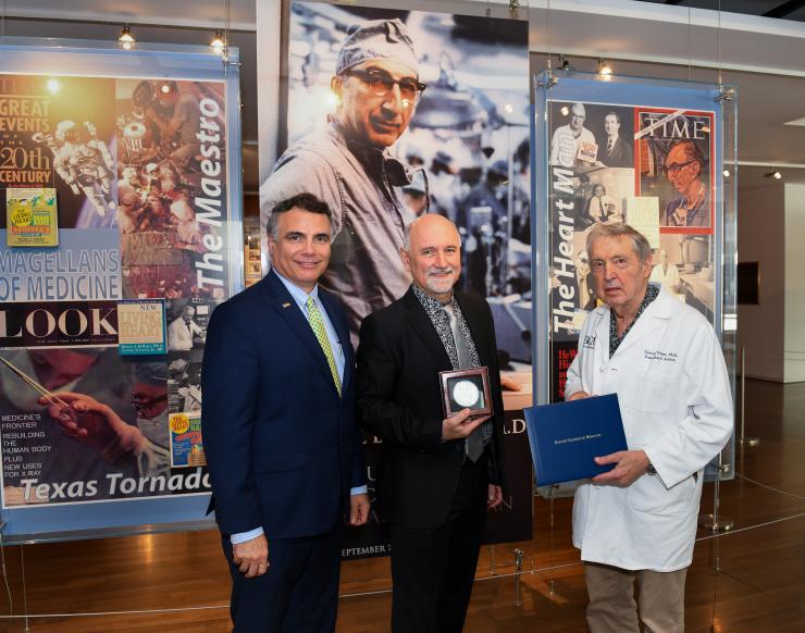 2019 DeBakey Awards - Dr. Aleksandar Milosavljevic Dr. Aleksandar Milosavljevic (middle) with Drs. Adam Kuspa (left) and George Noon (right).