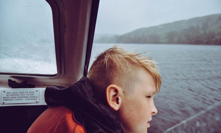 A child looking out across a body of water