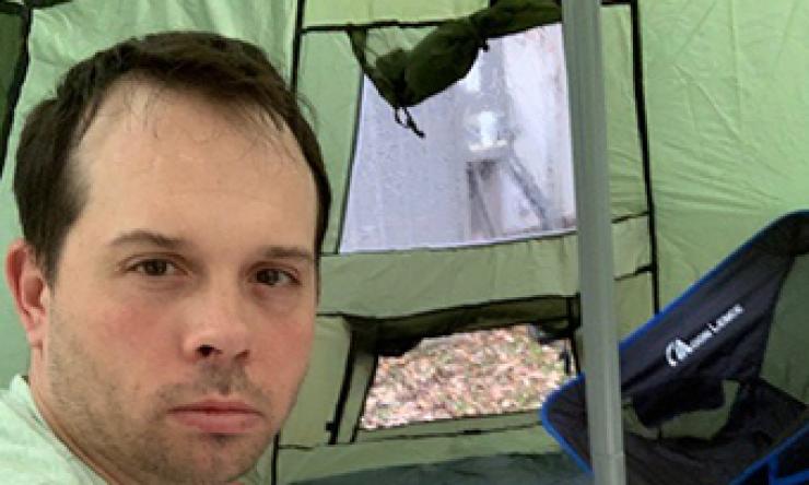 Dr. Brann quarantines in backyard tent