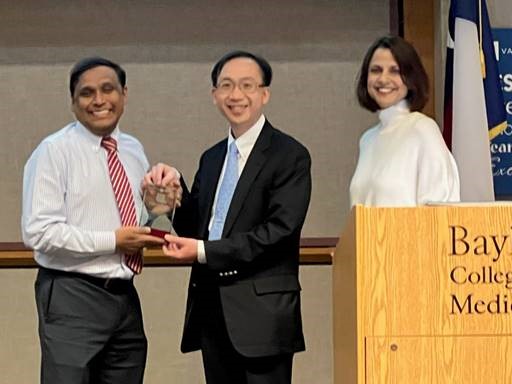 Dr. Vincent Wong receiving an award