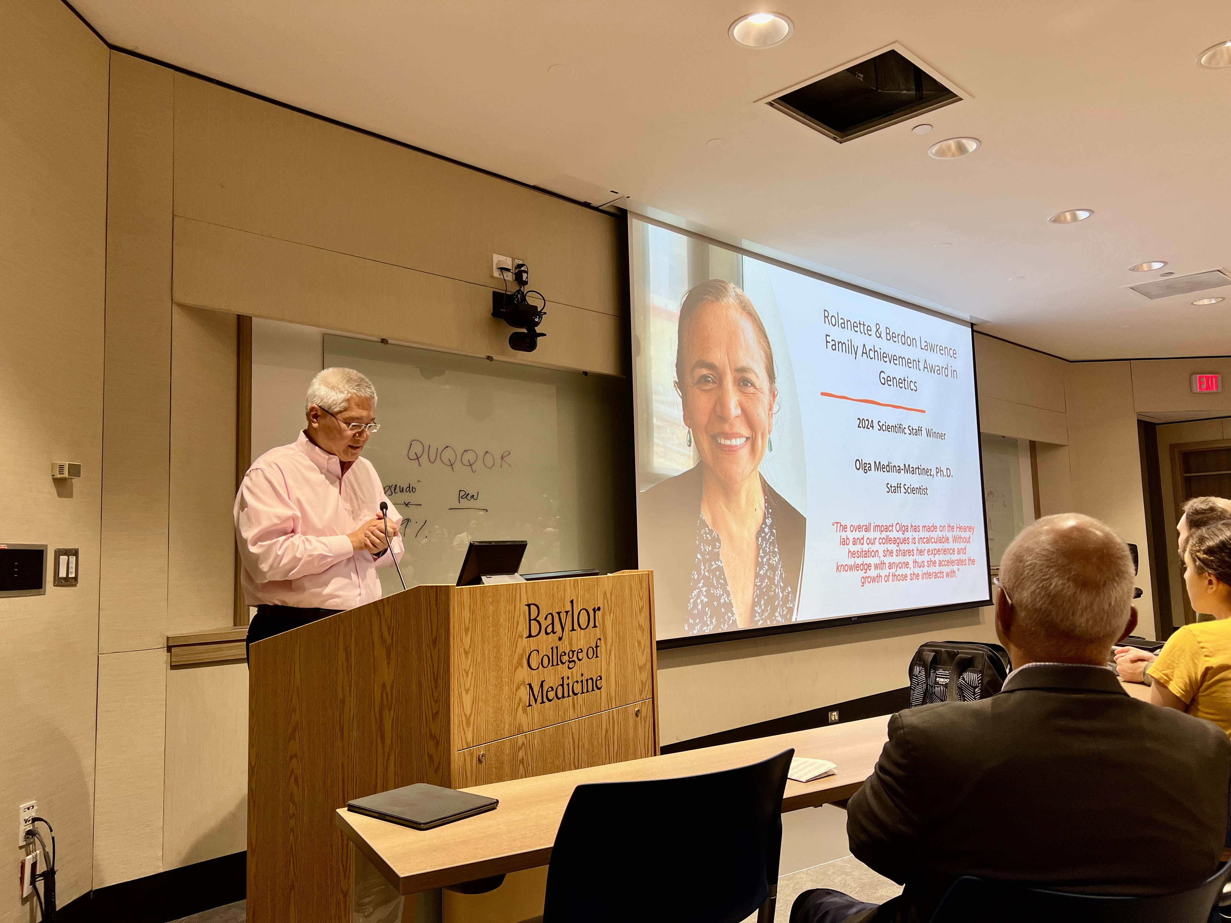 Dr. Lee introducing the Rolanette and Berdon Lawrence Family Achievement In Genetics 2024 Awards Recipient Olga Medina Martinez