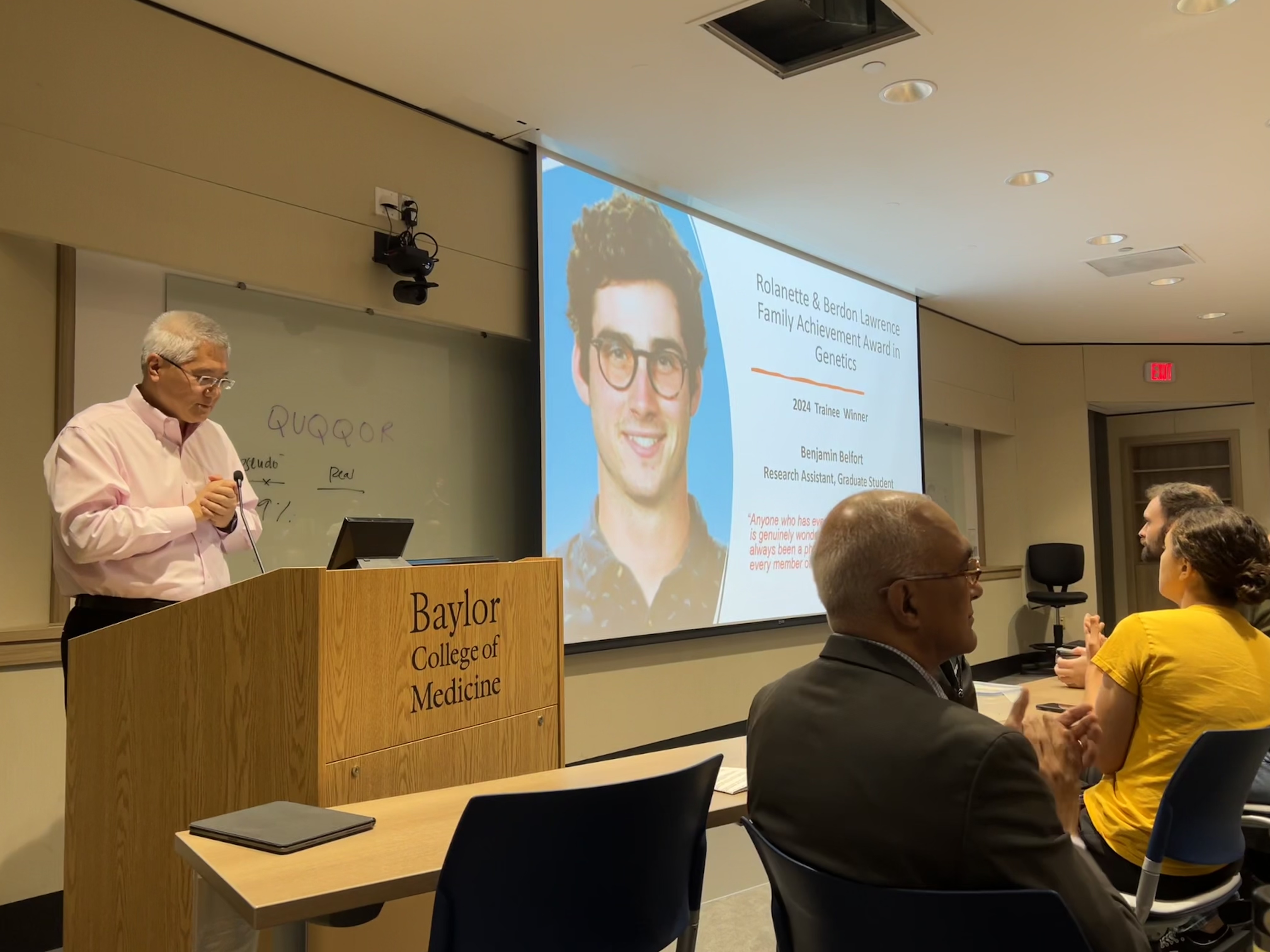 Dr. Lee introducing the Rolanette and Berdon Lawrence Family Achievement In Genetics 2024 Awards Recipient Benjamin Belfort