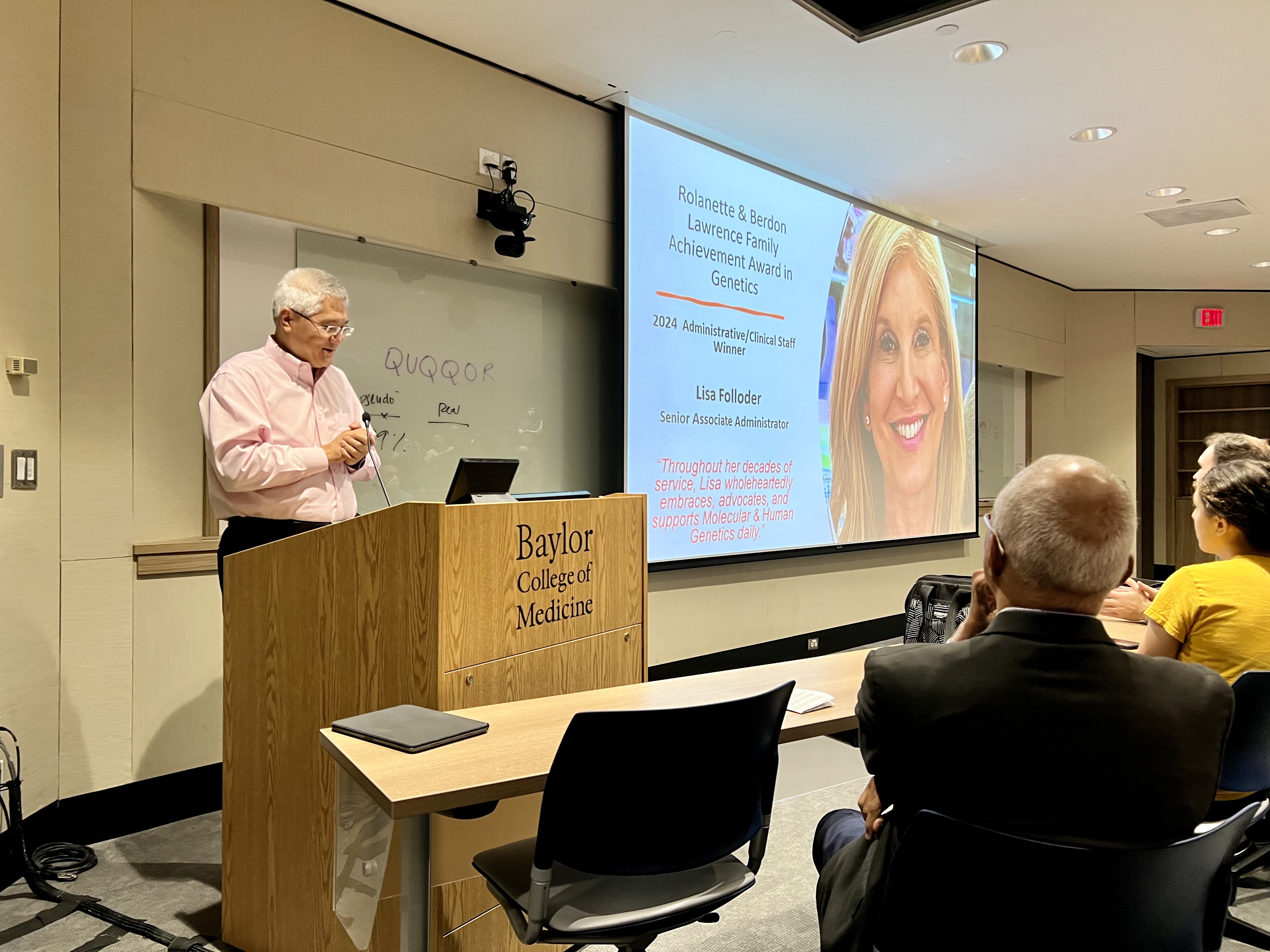 Dr. Lee announcing the Rolanette and Berdon Lawrence Family Achievement In Genetics 2024 Awards Recipient Lisa Folloder