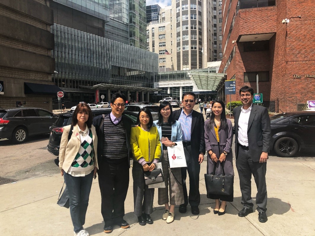 group of people standing in a downtown area