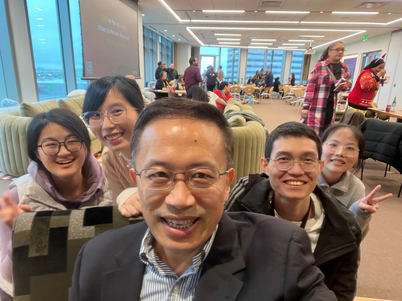 group of people smiling in a restaurant