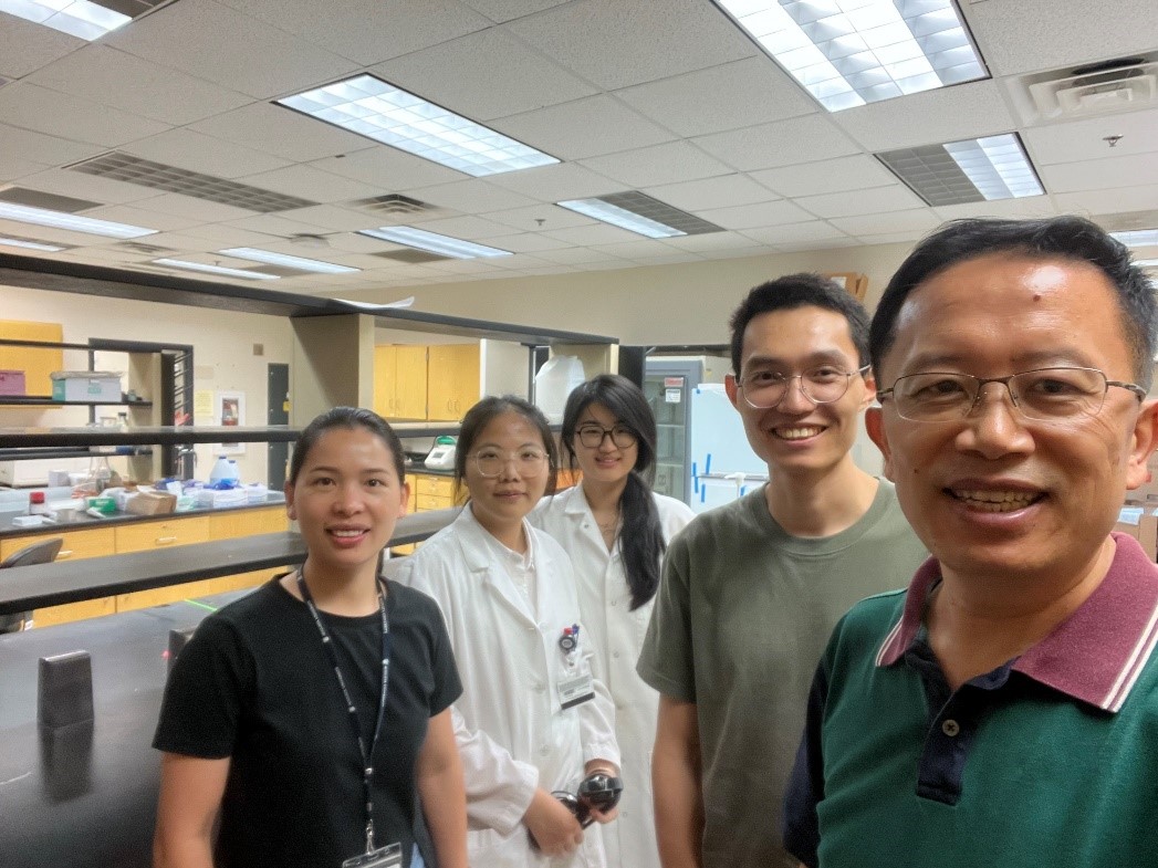 group of people smiling in a lab