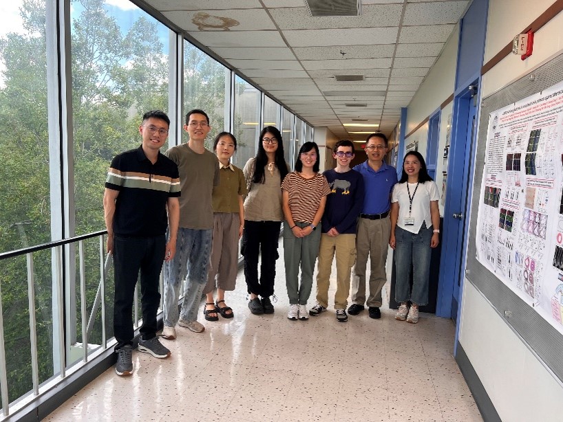 group of people standing in a hallway