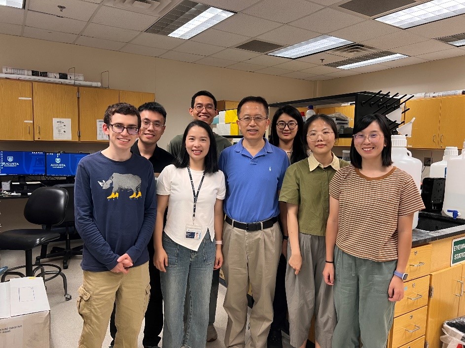 group of people standing in a lab