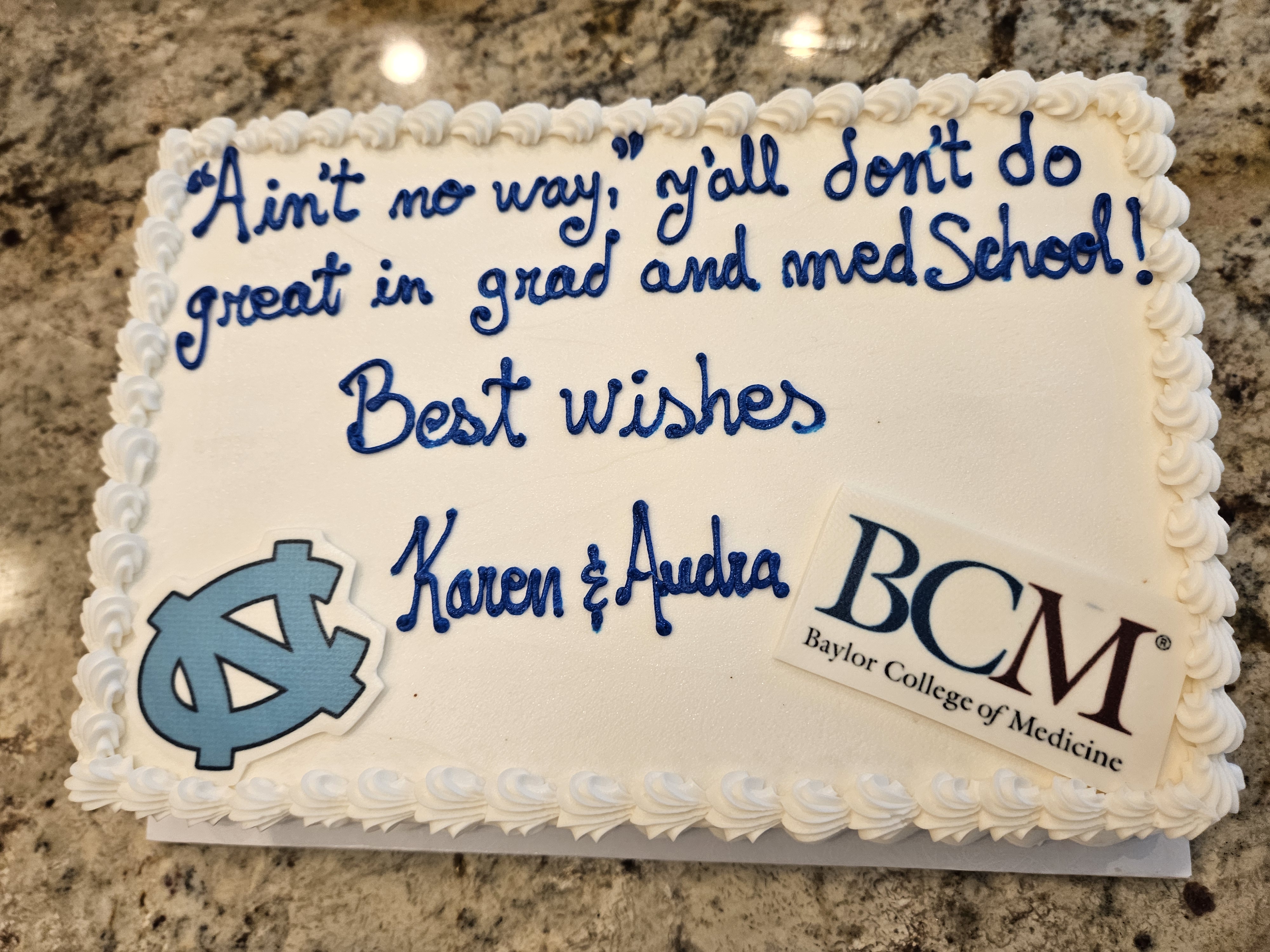 picture of a white cake with blue writing