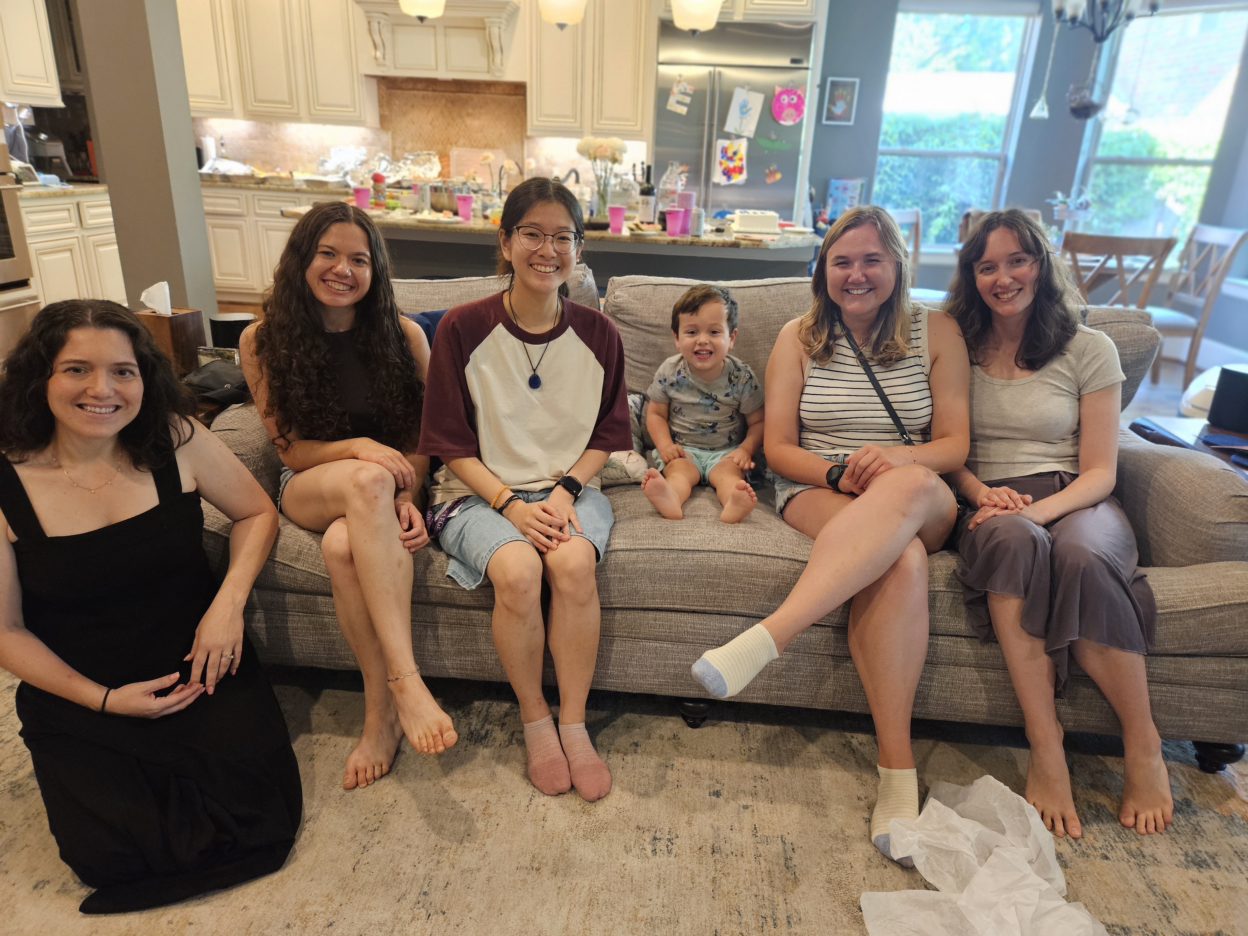 group of people sitting on a couch