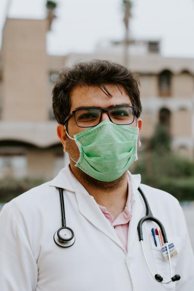 A frontline healthcare worker wearing a facemask