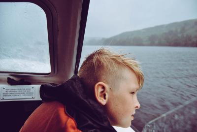 A child looking out across a body of water