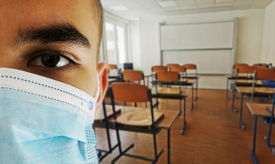 student in class wearing mask