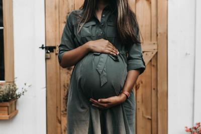 Woman holding her pregnant stomach