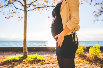 Pregnant mother walking outside