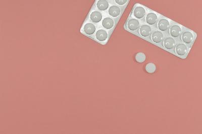 White pill on pink background