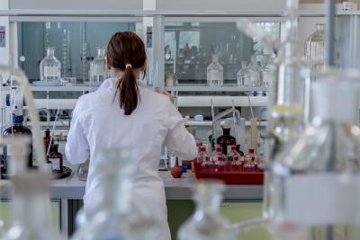 Woman in lab coat in research lab