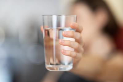 Woman holding water glass