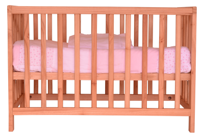 Photo of a crib, light wood with pink bedding. 