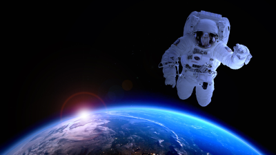 An astronaut in space above Earth