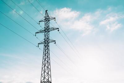 photograph of power lines with a blue sky background