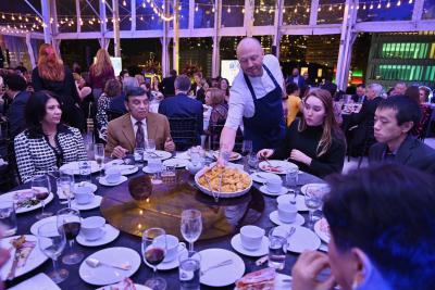 Chef Chris Haatuft serves guests at the BCM Culinary Stars Shine for Cancer Research.