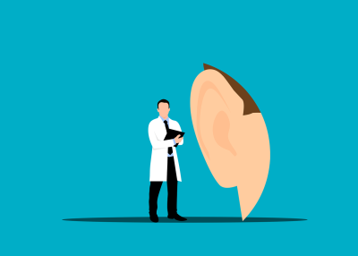 Drawing of a doctor standing next to a huge hear to represent hearing health