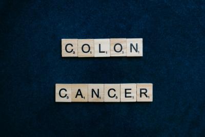 Colon Cancer spelled out in scrabble tiles.