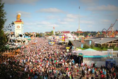 Photo of a large outdoor crowd at a fair