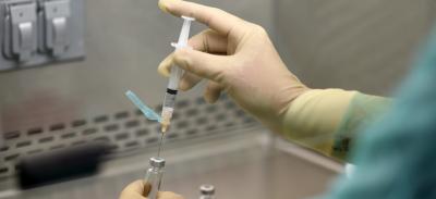 Researcher in a vaccine testing lab