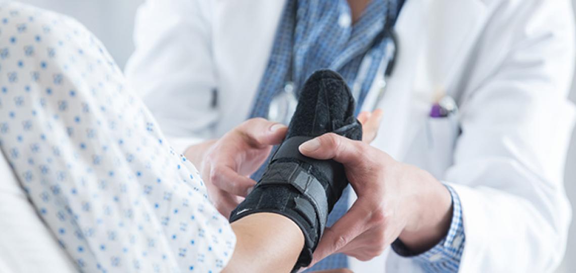 doctor with patient wearing soft cast