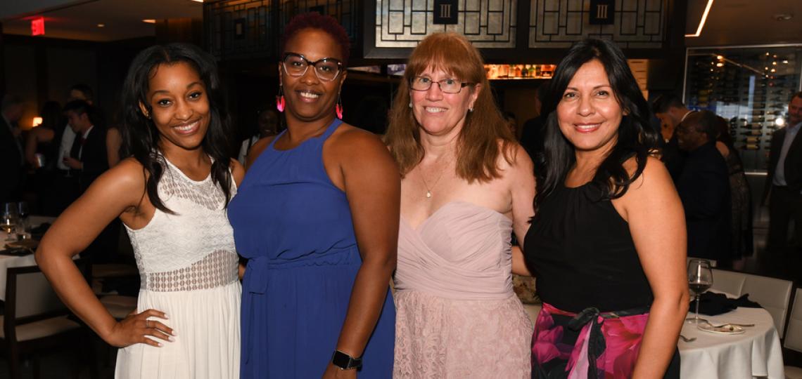 OBGYN Education Coordinators pose together at an event.